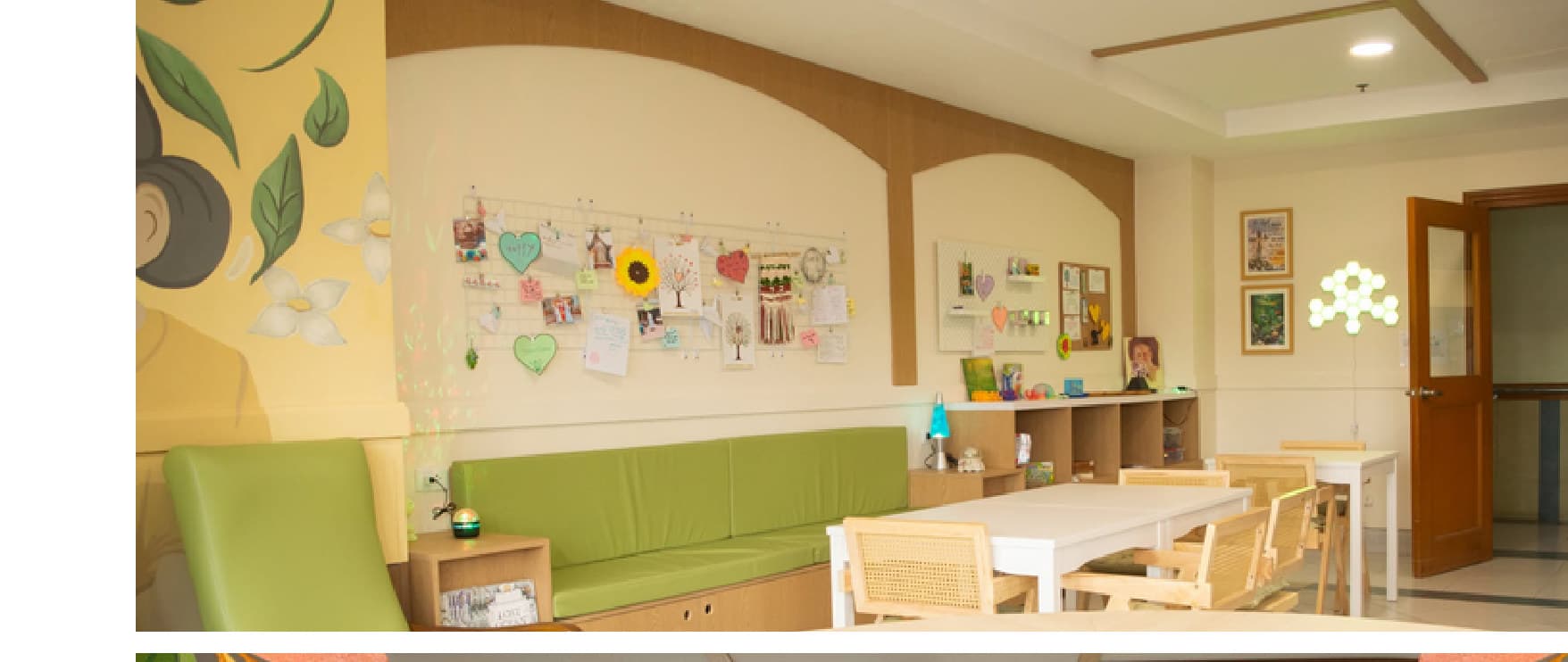 Built crafts room with green banquette and activity table